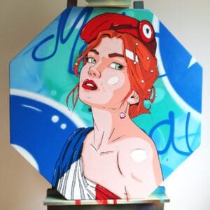 Photo de face de la peinture sur panneau STOP représentant Marianne drapée dans le drapeau français.