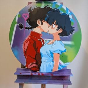 Photo d'un panneau graffé et peint. On y voit les personnages du manga Ranma 1/2, Ranma et Akane s'embrasser.