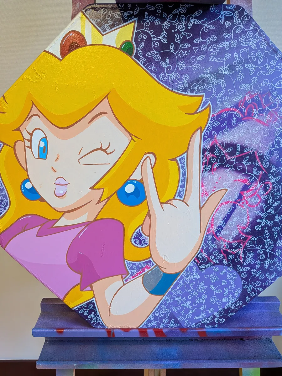 Œuvre unique peinte à la main sur un véritable panneau de signalisation routière octogonal « STOP » en aluminium (60 cm). Princesse Peach version punk-rock : clin d’œil coquin, langue tirée et cornes avec la main, robe rose iconique, fond violet profond orné de dentelle florale blanche et touches de spray rose fluo. Pièce street-pop 100 % artisanale, finitions haut de gamme, support métallique d’origine conservé. Parfait pour fans de Nintendo, gamers rétro, décoration geek chic ou intérieure vitaminée. Mot-clés : tableau Princesse Peach, panneau stop peint, street art Mario, art Nintendo, décoration gaming, pop art geek, œuvre originale sur panneau routier. Expédition rapide et sécurisée !